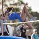 Track & field athlete jumping over a pole