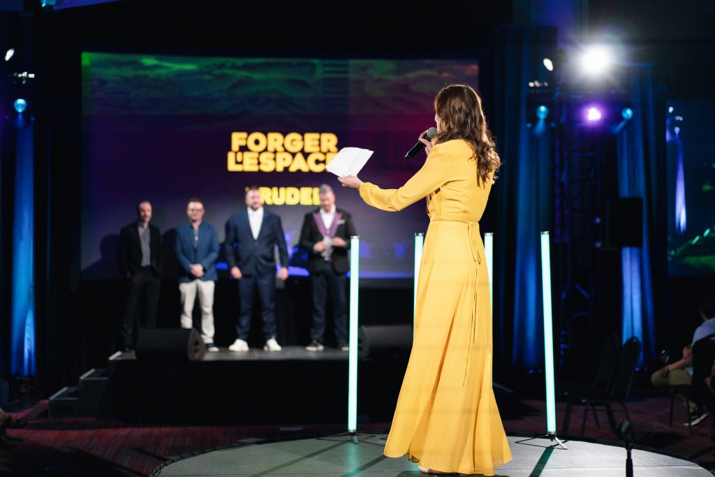 Female speaker welcoming invitees