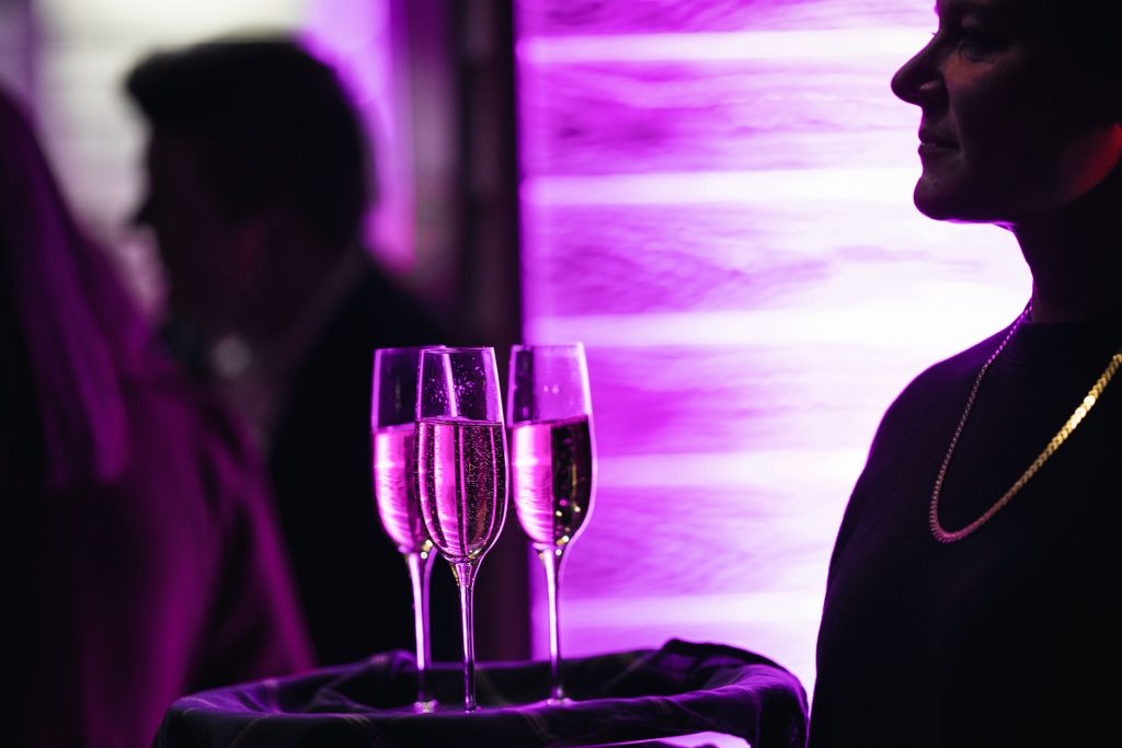 Champagne flutes with purple light
